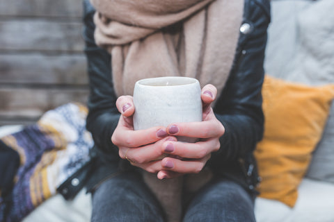 files/woman-holding-coffee-mug.jpg